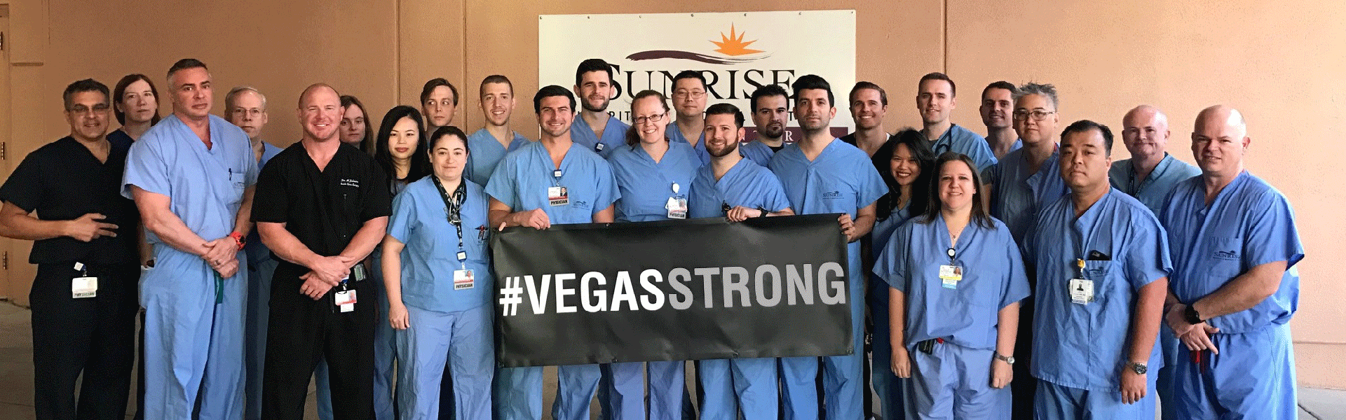 Hospital staff with Vegas Strong banner