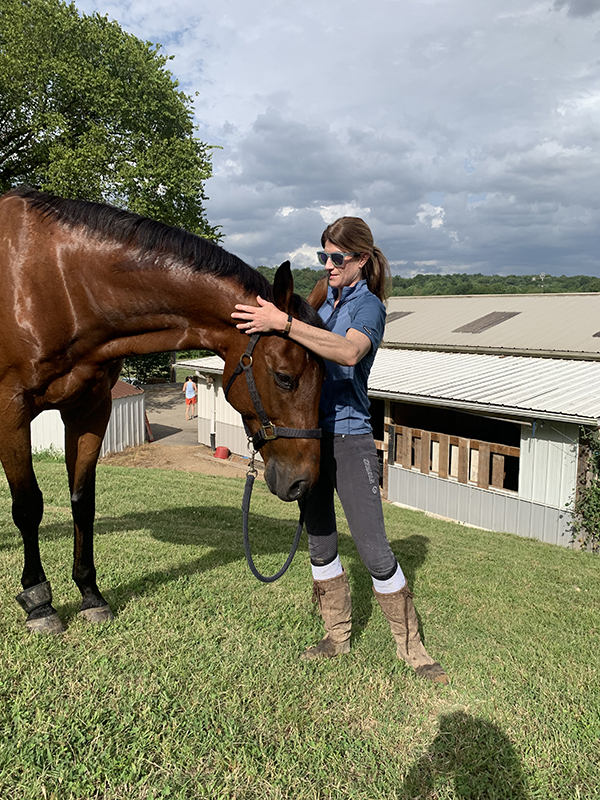 Sydney Hester, MD, with her horse, Hughey