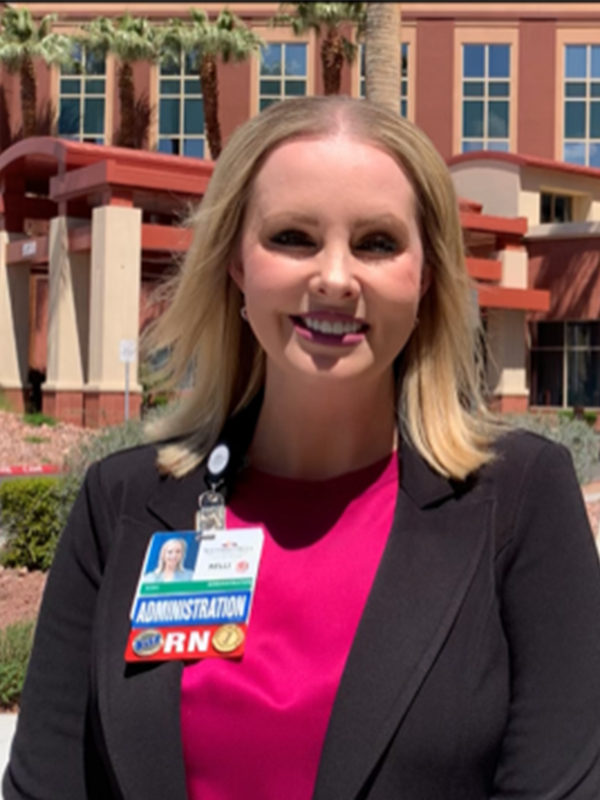 Kelli Wray standing outside hospital