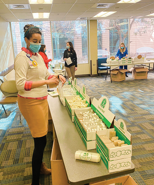 volunteers prepare hygiene kits