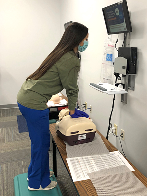 Sarah Briceno, ICU nurse at Doctors Hospital of Augusta in Augusta, Ga., refreshes her CPR skills.