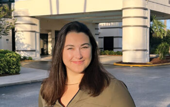 Photo of Doni Laughlin-Imbimbo, director of supply chain at HCAhealthcare, stands outside at HCA Healthcare Florida St. Petersburg Hospital.