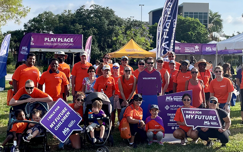Group of people wearing orange shirts at a March for Babies event